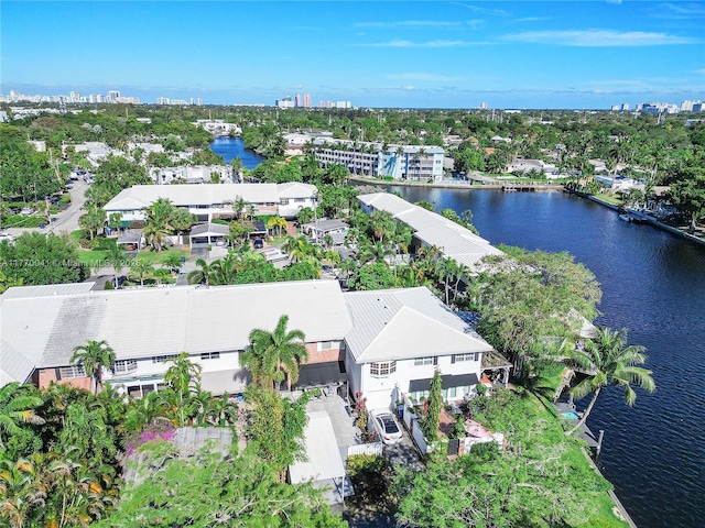 drone / aerial view featuring a water view and a view of city