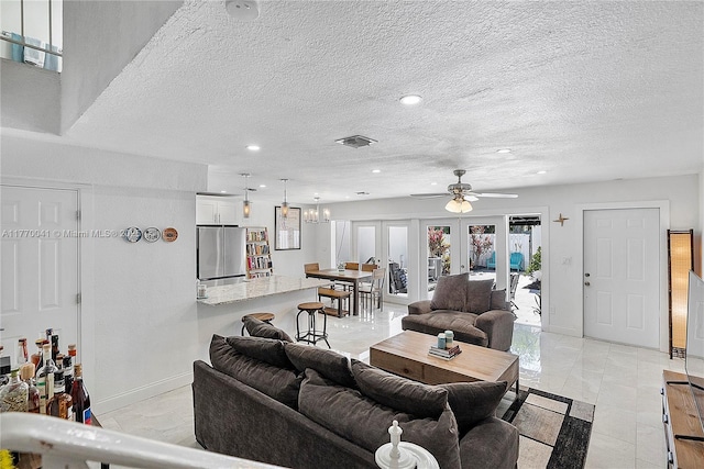 living room featuring baseboards, recessed lighting, french doors, a ceiling fan, and visible vents