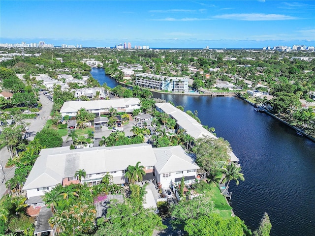 drone / aerial view with a water view, a residential view, and a city view