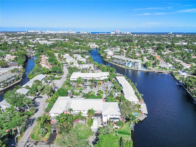 drone / aerial view with a view of city, a residential view, and a water view