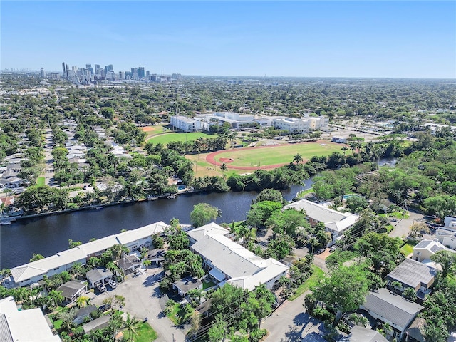 drone / aerial view with a water view, a residential view, and a view of city