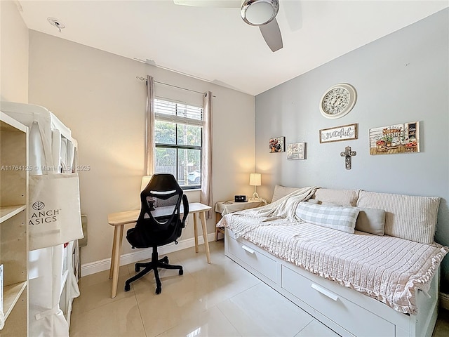 bedroom featuring light tile patterned floors, baseboards, and ceiling fan