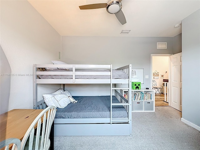 bedroom with visible vents, baseboards, and ceiling fan