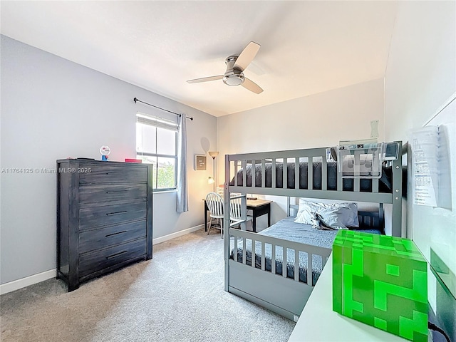 bedroom featuring ceiling fan, baseboards, and carpet floors