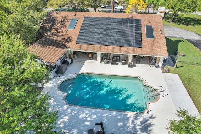 outdoor pool featuring a patio, an outdoor living space, a fenced backyard, and a lawn