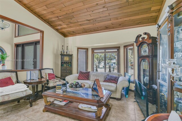 living area with vaulted ceiling, tile patterned flooring, and wood ceiling