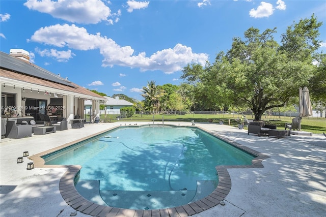 view of swimming pool with a fenced in pool, fence, an outdoor living space, and a patio