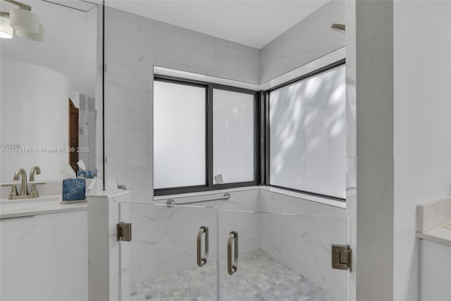 bathroom with vanity and a shower stall