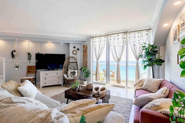 living room with floor to ceiling windows and recessed lighting