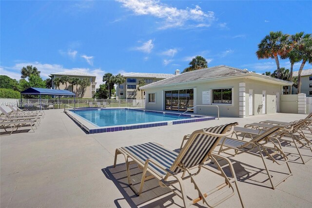 3515 Village Blvd Unit 105, West Palm Beach, FL 33409 - community pool featuring fence and a patio area