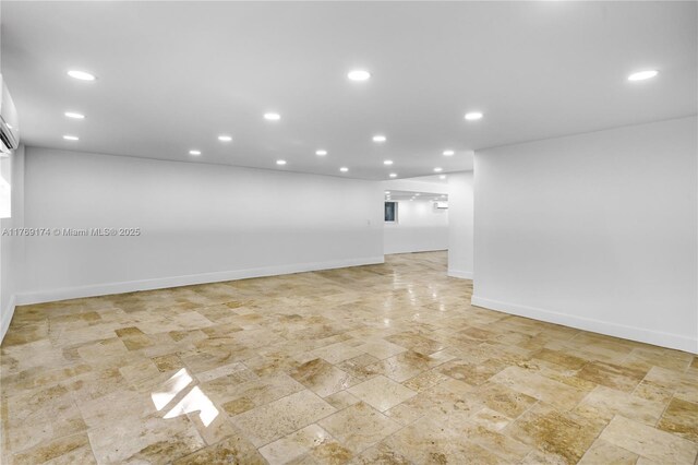 6300 SW Mitchell Dr, Coral Gables, FL 33158 - below grade area with stone finish floor, baseboards, and recessed lighting