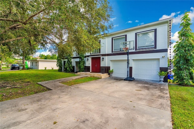 6300 SW Mitchell Dr, Coral Gables, FL 33158 - view of front of home featuring driveway, a garage, a front lawn, and stucco siding