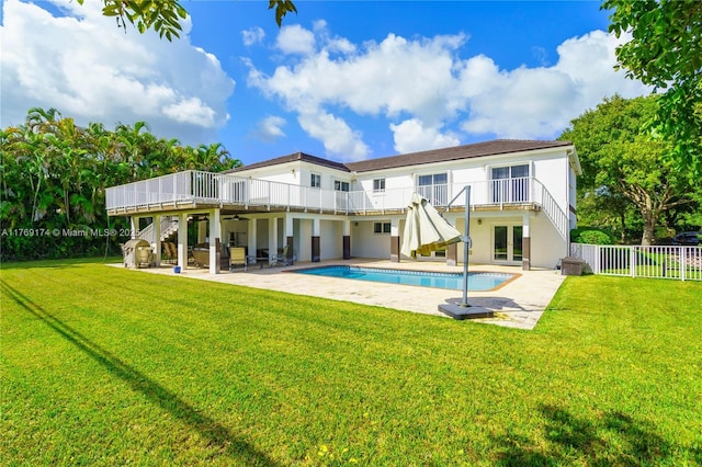 6300 SW Mitchell Dr, Coral Gables, FL 33158 - back of property with a ceiling fan, a lawn, fence, and a patio area