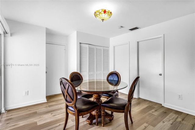 6300 SW Mitchell Dr, Coral Gables, FL 33158 - dining space featuring baseboards, visible vents, and light wood-style floors