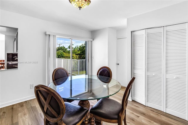 6300 SW Mitchell Dr, Coral Gables, FL 33158 - dining room with baseboards and light wood-style floors