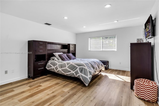 6300 SW Mitchell Dr, Coral Gables, FL 33158 - bedroom featuring light wood-style flooring, recessed lighting, baseboards, and visible vents