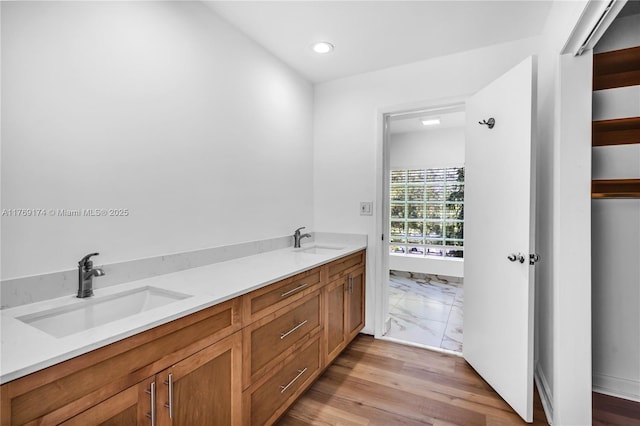 6300 SW Mitchell Dr, Coral Gables, FL 33158 - full bath with double vanity, a sink, recessed lighting, and wood finished floors