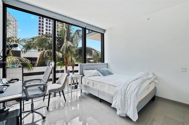 68 SE 6th St Unit 805, Miami, FL 33131 - bedroom with baseboards and floor to ceiling windows