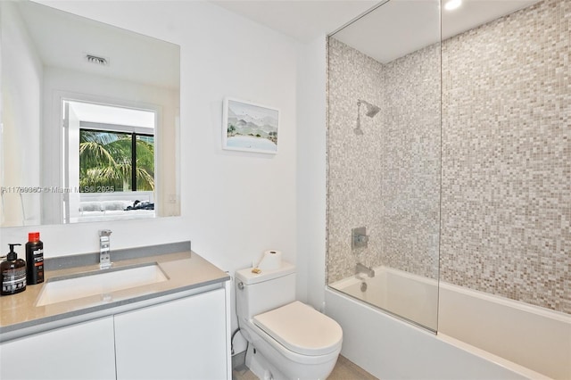68 SE 6th St Unit 805, Miami, FL 33131 - bathroom featuring vanity, visible vents, toilet, and bath / shower combo with glass door