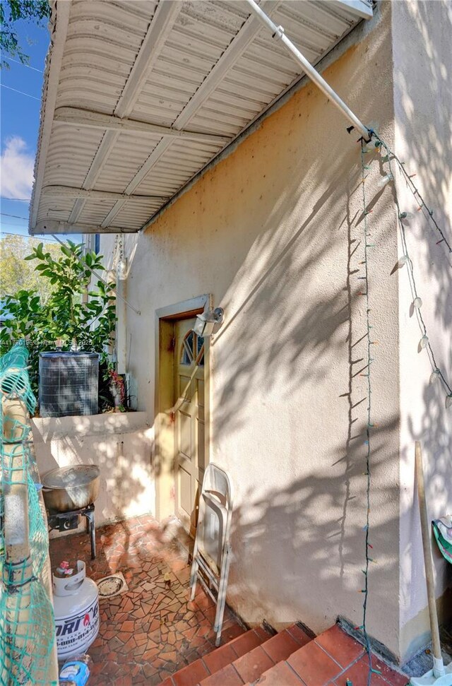 731 SW 8th Ave, Hallandale Beach, FL 33009 - exterior space with stucco siding and a patio area