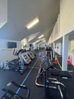 12650 Vista Isles Dr Unit 923, Sunrise, FL 33325 - workout area with vaulted ceiling