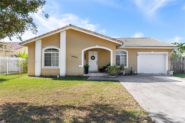 14930 SW 178th Ter, Miami, FL 33187 - view of front of house with a tiled roof, concrete driveway, stucco siding, and fence