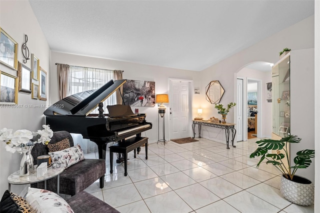 14930 SW 178th Ter, Miami, FL 33187 - living area with light tile patterned flooring and arched walkways