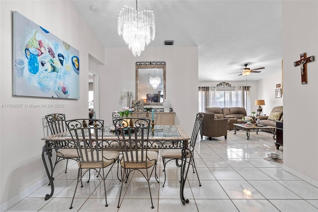 14930 SW 178th Ter, Miami, FL 33187 - dining space featuring a textured ceiling, visible vents, baseboards, ceiling fan with notable chandelier, and light tile patterned floors