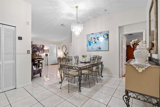 14930 SW 178th Ter, Miami, FL 33187 - dining space with light tile patterned floors, a notable chandelier, baseboards, and vaulted ceiling
