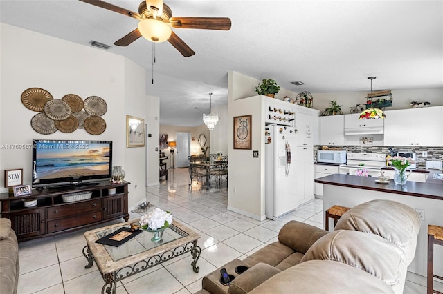 14930 SW 178th Ter, Miami, FL 33187 - living room with light tile patterned floors, ceiling fan with notable chandelier, and visible vents