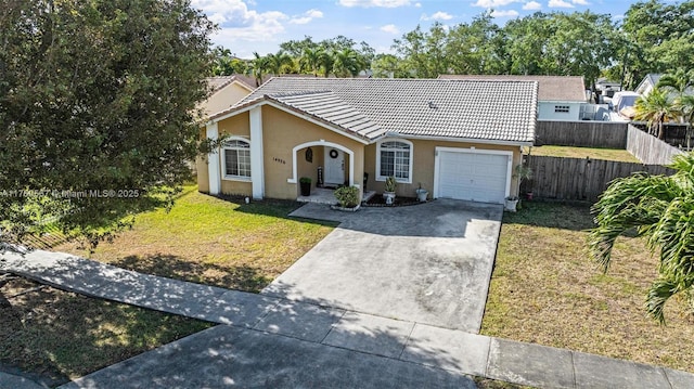 14930 SW 178th Ter, Miami, FL 33187 - view of front of home featuring concrete driveway, stucco siding, fence, an attached garage, and a tiled roof