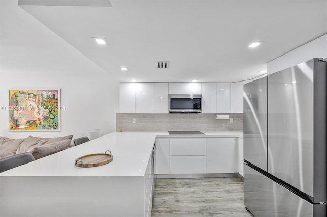 14601 N Kendall Dr Unit 206K, Miami, FL 33186 - kitchen featuring white cabinets, a peninsula, stainless steel appliances, and modern cabinets