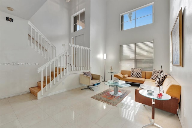 16103 Opal Creek Dr, Weston, FL 33331 - tiled living room featuring a high ceiling, stairway, and baseboards