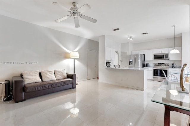 16103 Opal Creek Dr, Weston, FL 33331 - living area featuring ceiling fan, baseboards, and light tile patterned floors