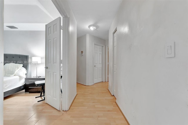 16103 Opal Creek Dr, Weston, FL 33331 - hallway featuring light wood-style flooring and baseboards