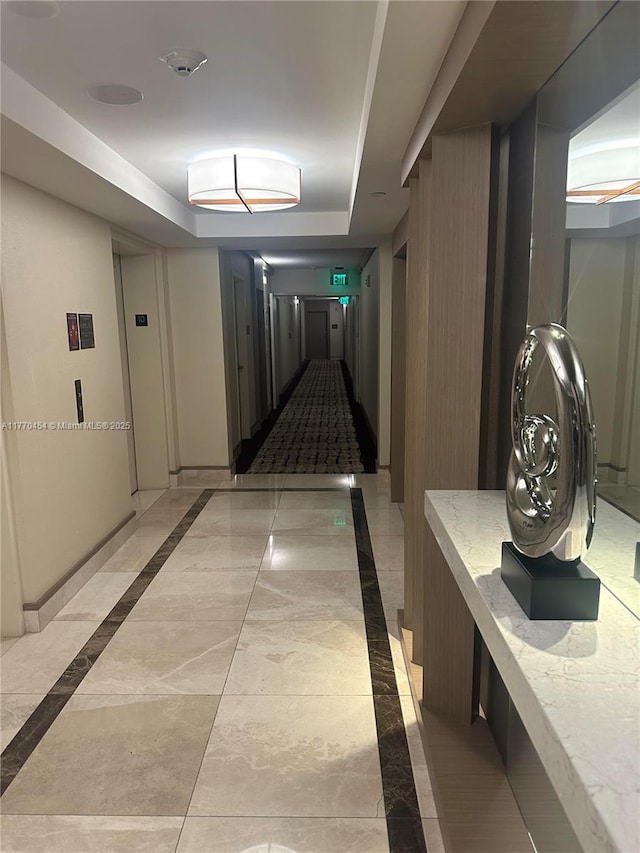 20225 NE 34th St Unit 1022, Aventura, FL 33180 - corridor with baseboards, marble finish floor, elevator, and a raised ceiling