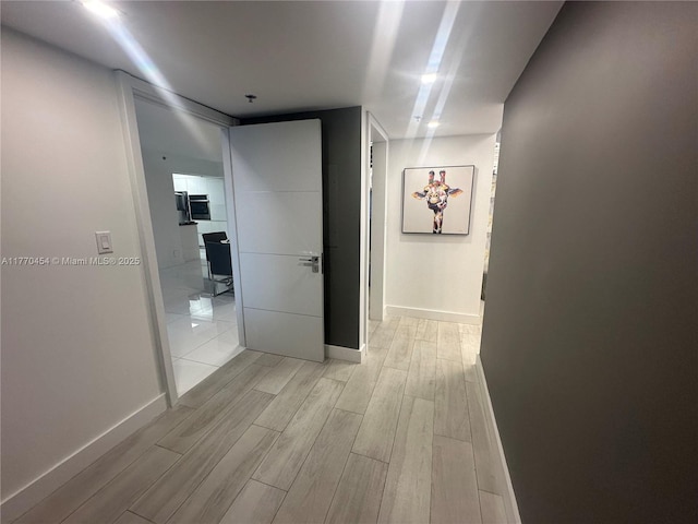 20225 NE 34th St Unit 1022, Aventura, FL 33180 - hall featuring baseboards and light wood-style floors