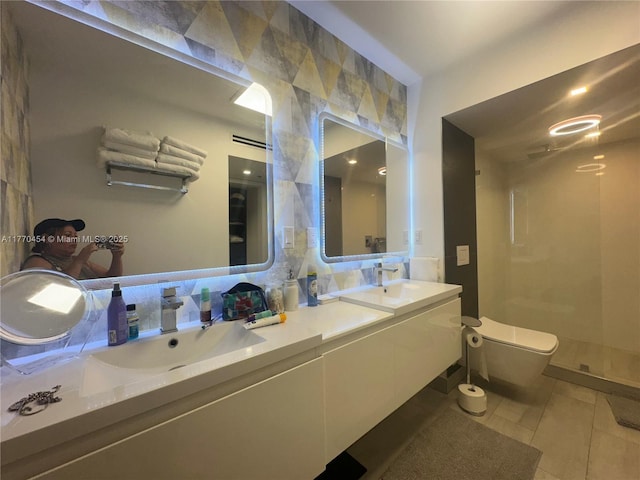 20225 NE 34th St Unit 1022, Aventura, FL 33180 - bathroom featuring tile patterned flooring, double vanity, toilet, a sink, and a walk in shower