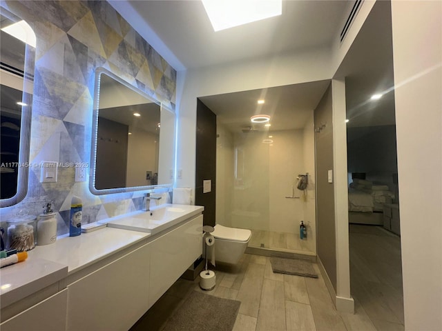20225 NE 34th St Unit 1022, Aventura, FL 33180 - full bathroom with visible vents, toilet, wood finished floors, vanity, and a stall shower