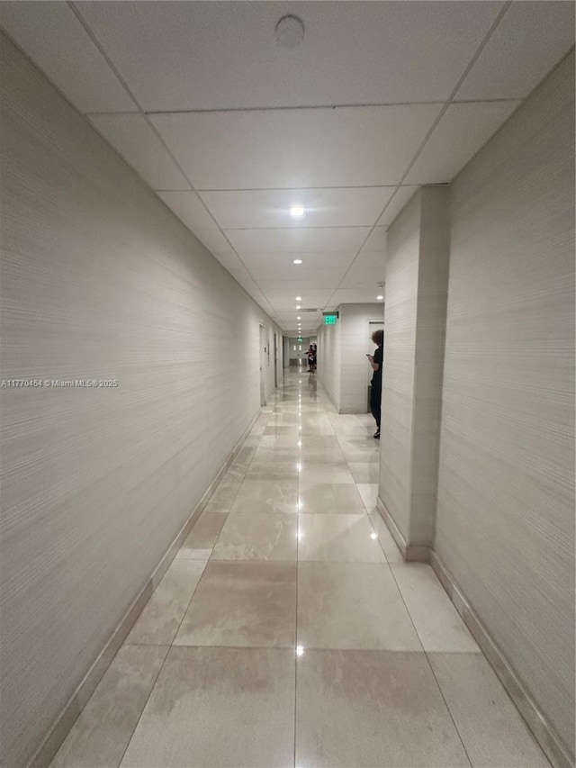 20225 NE 34th St Unit 1022, Aventura, FL 33180 - corridor with baseboards, a drop ceiling, and light tile patterned floors
