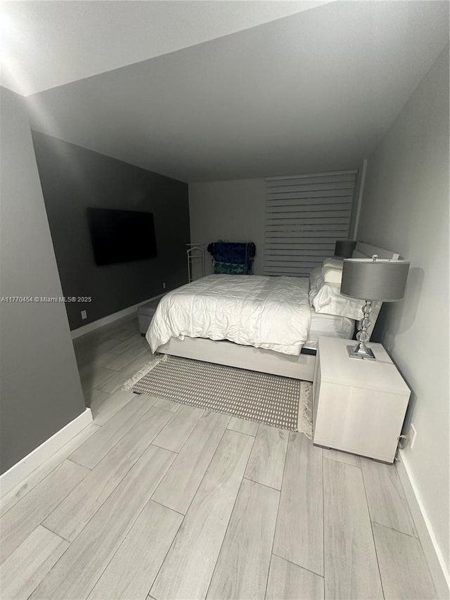20225 NE 34th St Unit 1022, Aventura, FL 33180 - bedroom featuring wood finish floors and baseboards