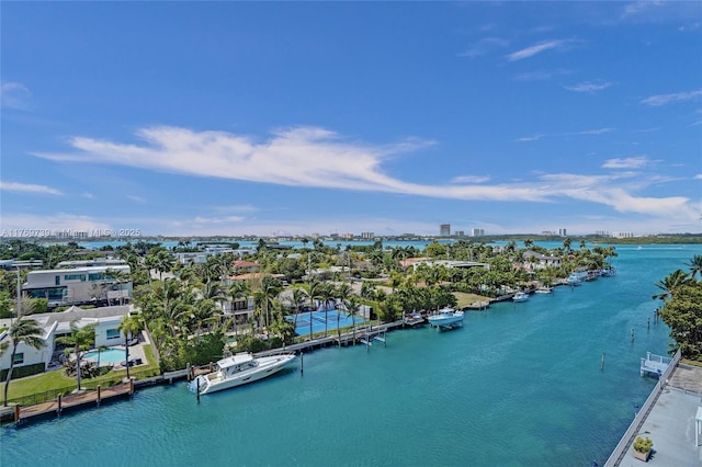 birds eye view of property with a water view