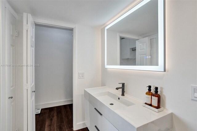 10000 W Bay Harbor Dr Unit Ph23, Bay Harbor Islands, FL 33154 - bathroom featuring vanity and wood finished floors