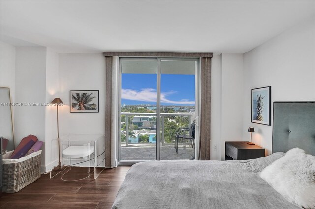 10000 W Bay Harbor Dr Unit Ph23, Bay Harbor Islands, FL 33154 - bedroom with access to exterior and dark wood-type flooring