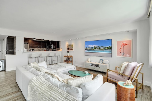 10000 W Bay Harbor Dr Unit Ph23, Bay Harbor Islands, FL 33154 - living area featuring wood finished floors and baseboards