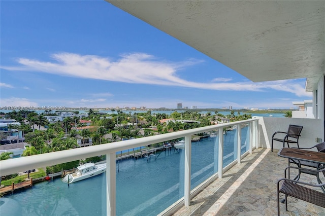 balcony featuring a water view