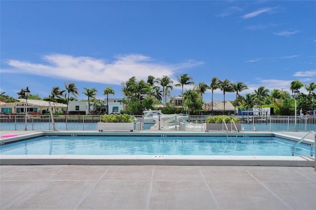 pool featuring a patio and fence
