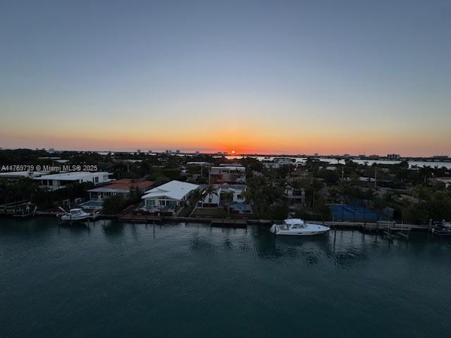 aerial view at dusk with a water view