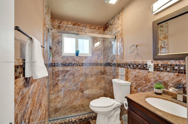 30328 SW 158th Pl, Homestead, FL 33033 - bathroom featuring toilet, a marble finish shower, and vanity