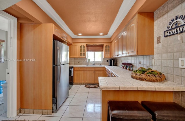 30328 SW 158th Pl, Homestead, FL 33033 - kitchen featuring range, freestanding refrigerator, glass insert cabinets, a peninsula, and a sink